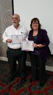 Image of members Dan Close and Jolene Haas with 10 year membership certificates.